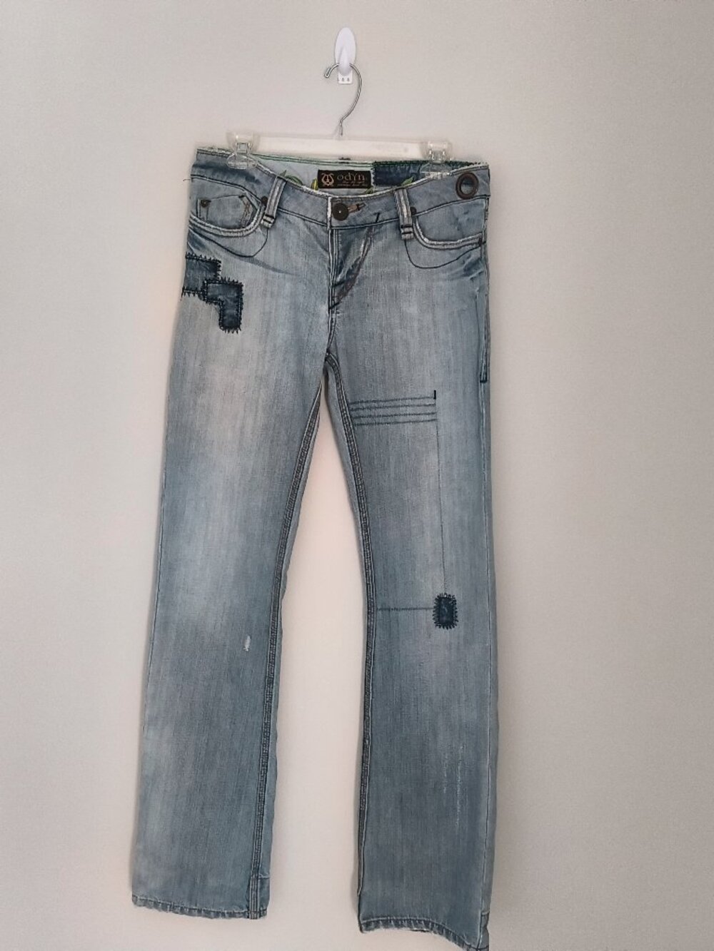 Odyn light-wash blue denim low-rise distressed jeans with dark patchwork size 28